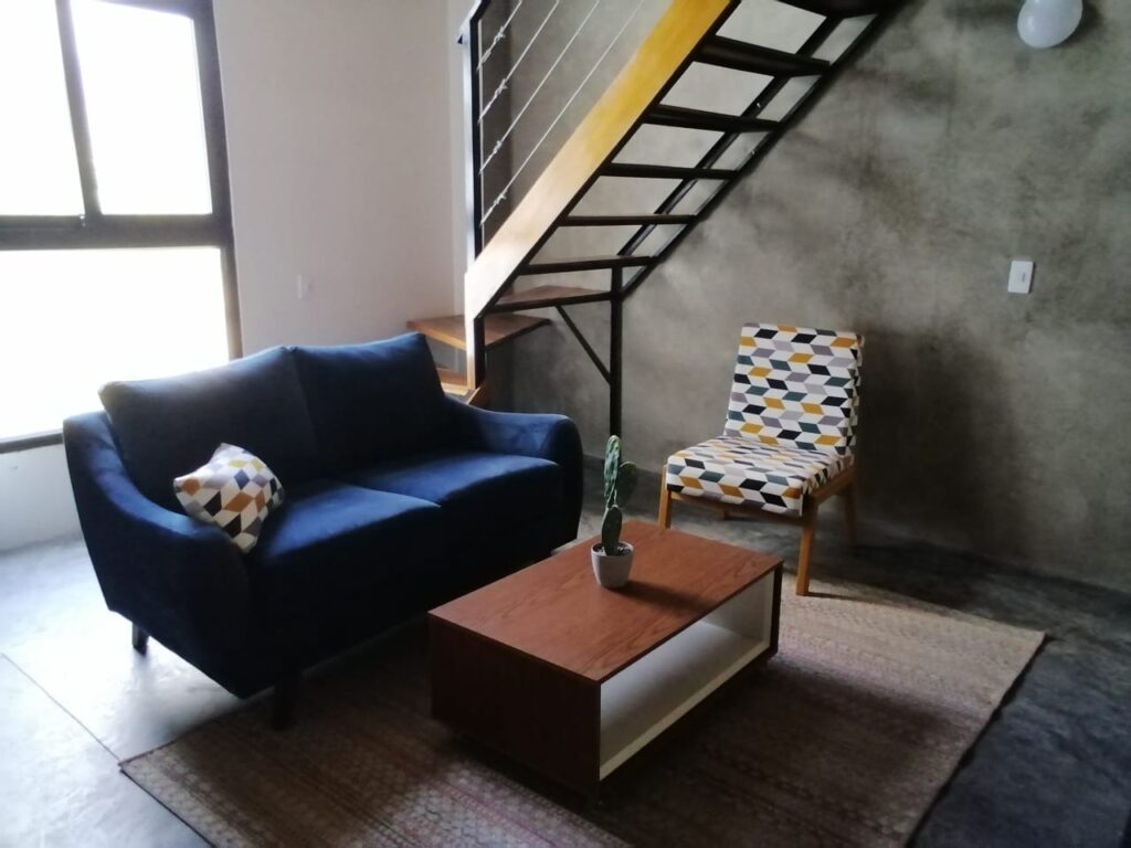 Sala de estar con ambiente relajante en alojamiento boutique Caribe